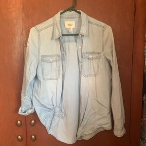 Light denim, button up, long sleeve shirt.